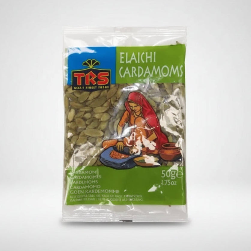 A 50g package of TKS Elaichi Cardamoms (Gojen Kardemomphe) seeds, featuring a green and blue label with an illustration of a woman grinding spices.