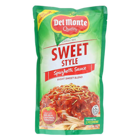 A package of Del Monte Quality Sweet Style Spaghetti Sauce, featuring a green and red stand-up pouch with a photo of spaghetti in red sauce on the front.