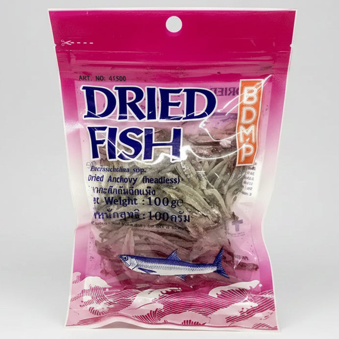 A 100g package of BDMP Dried Fish (dried anchovy headsesse) in a pink and clear plastic bag with a hanging hole, shown on a white background.