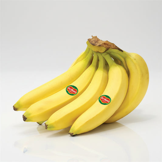 A bunch of ripe yellow bananas with green stems, featuring two visible 'Cavellaro' brand stickers, set against a plain white background.