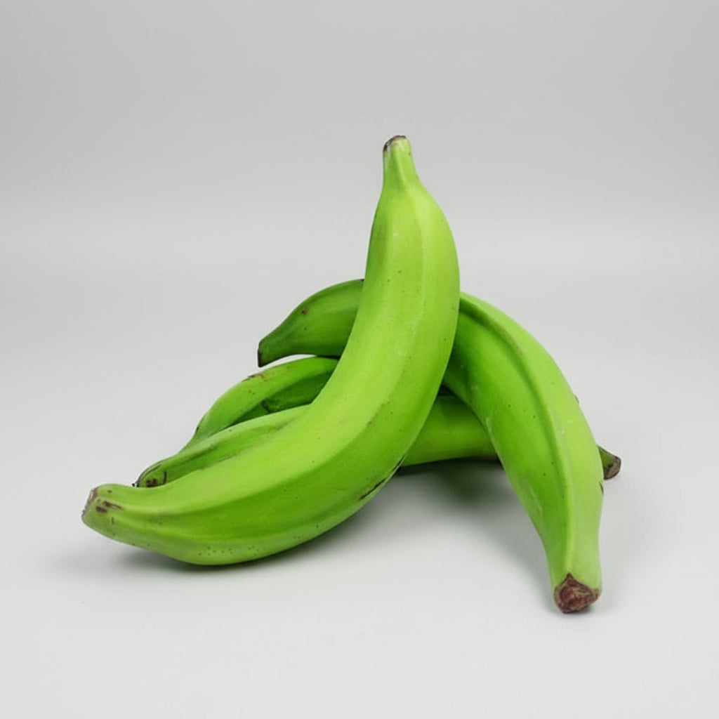 Green bananas on a white background