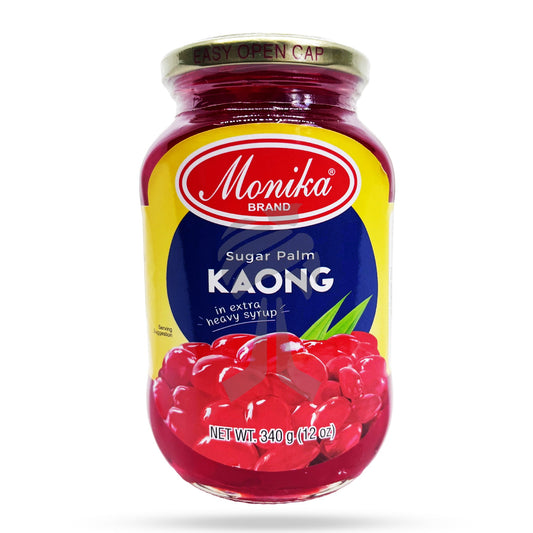 A glass jar of Monika Brand Kaong Sugar Palm syrup with a gold metal cap, set against a plain white background with a soft shadow underneath.