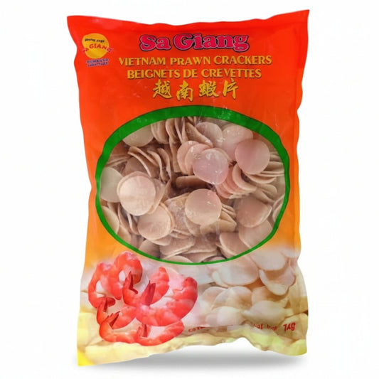 A bag of Sa Giang Vietnam Prawn Crackers (Beignets de Crevettes) on a plain white background. The packaging is bright orange with a green oval window showing the round, pale beige crackers inside, and an illustration of a pink shrimp at the bottom.