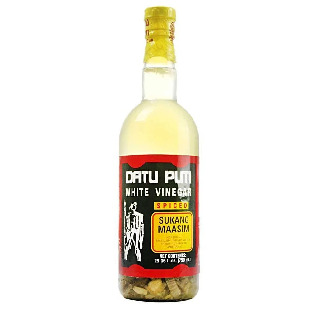 Bottle of Datu Puti White Vinegar with a colorful label on a white background