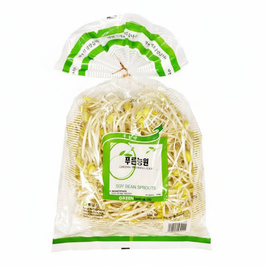 A clear plastic bag of green soy bean sprouts with a green and white label, shown on a plain white background with the bag slightly open at the top.