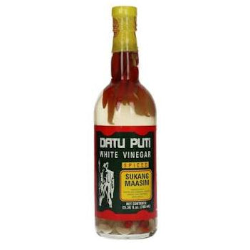 A bottle of Datu Puti White Vinegar, Sukang Masim Spiced, featuring a black and red label with a yellow accent, sealed with a gold cap, on a plain white background.